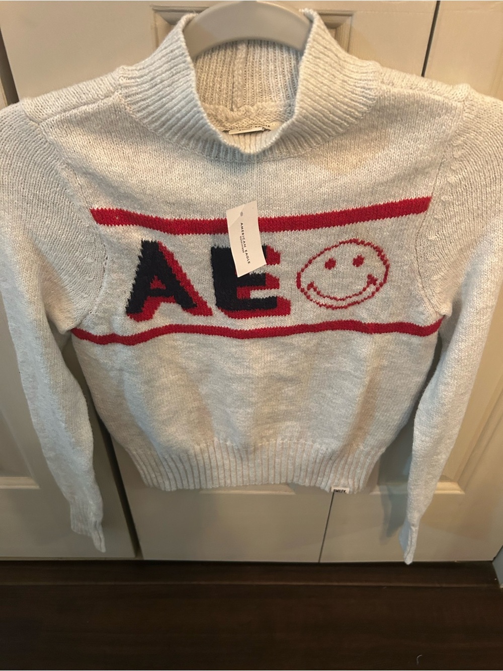 Cream Graphic Knit Sweater with Red & Black Accent